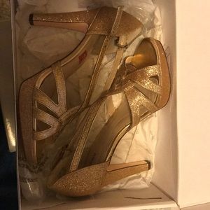 Gold sparkly heels.